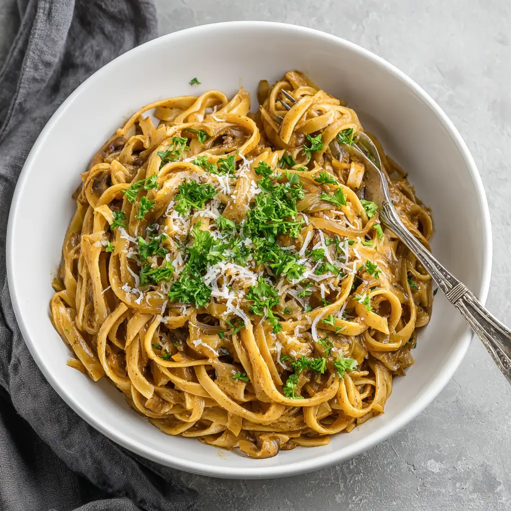 Gluten Free One-Pot French Onion Pasta That’s Rich, Cozy & Ready Fast 3 Gluten Free One-Pot French Onion Pasta served in a rustic white bowl with caramelized onions and thyme